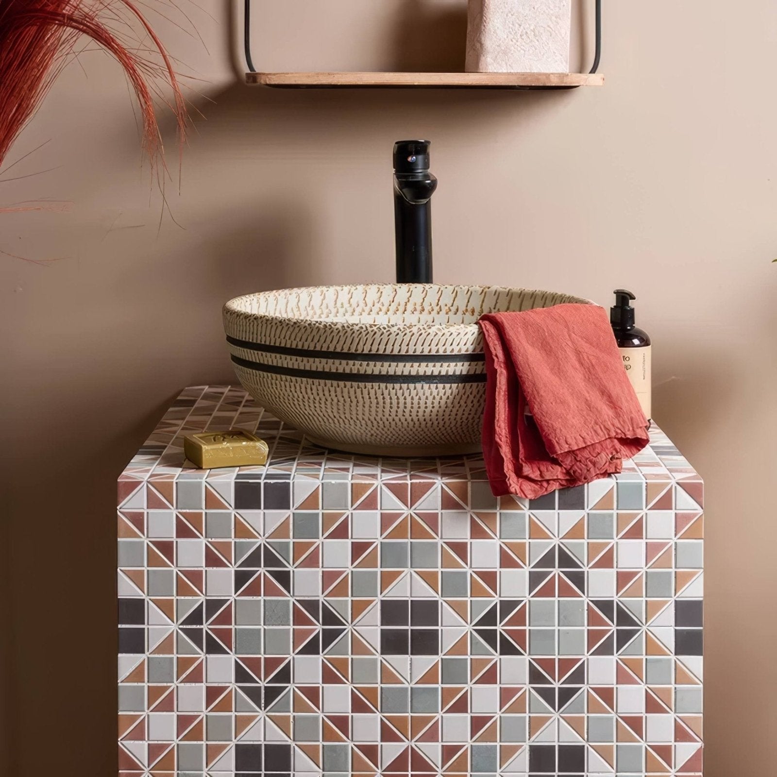 Pavilion Porcelain Russet Red geometric porcelain mosaic with a beige striped vessel sink