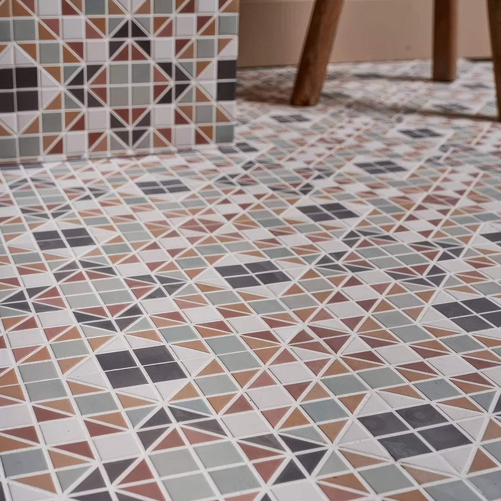 Geometric mosaic porcelain tile floor pavilion russet red featuring triangular and square tiles in muted earth tones