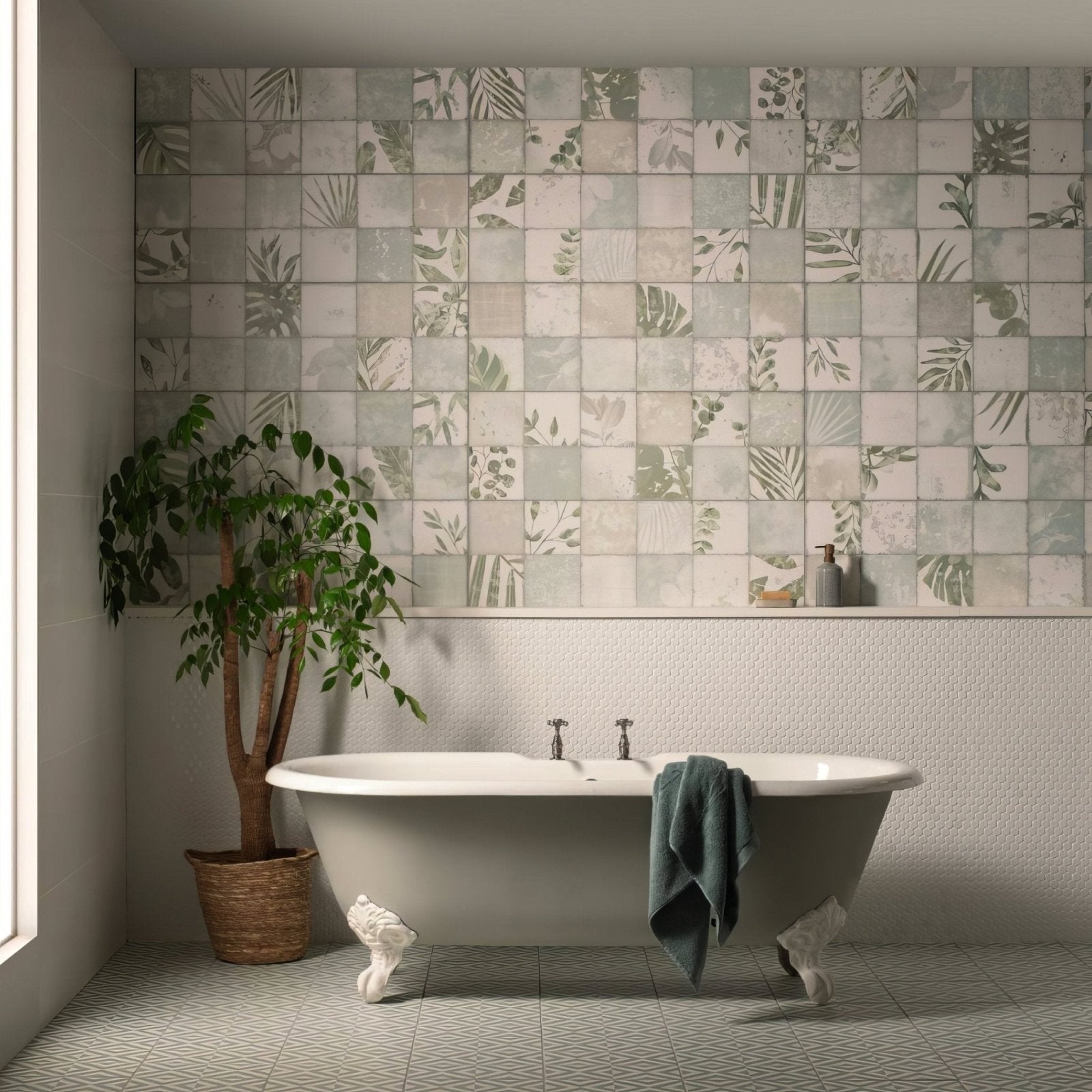 White clawfoot bathtub with ornate feet and a teal towel draped over the side in penshaw teal on chalk finish