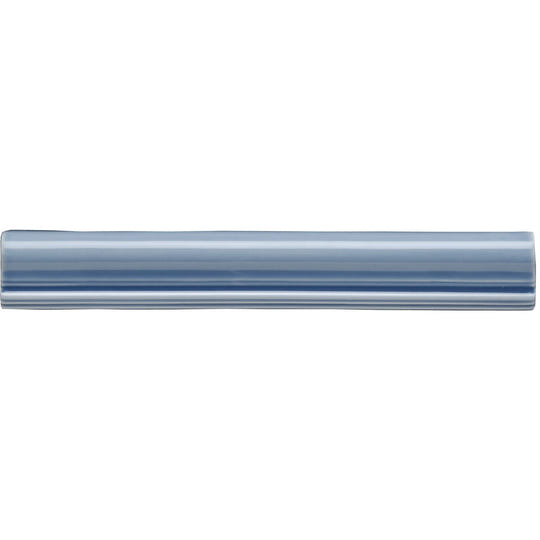 A sleek translucent blue glass periwinkle dado rail moulding tile with a smooth glossy finish and subtle horizontal ridges