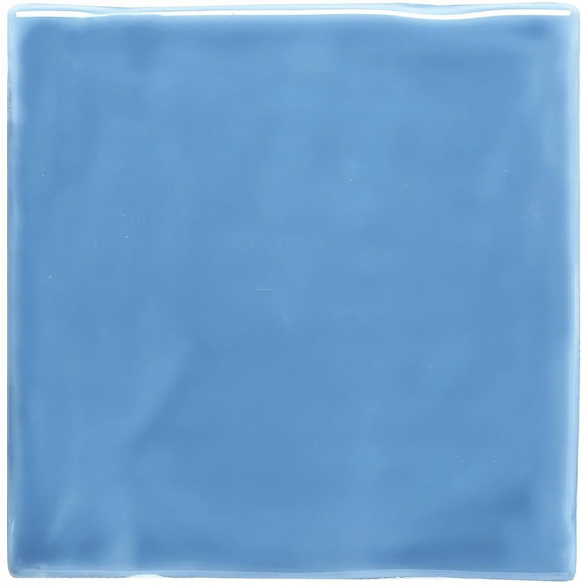 A square glossy blue ceramic tile with a smooth slightly reflective surface called periwinkle field tile