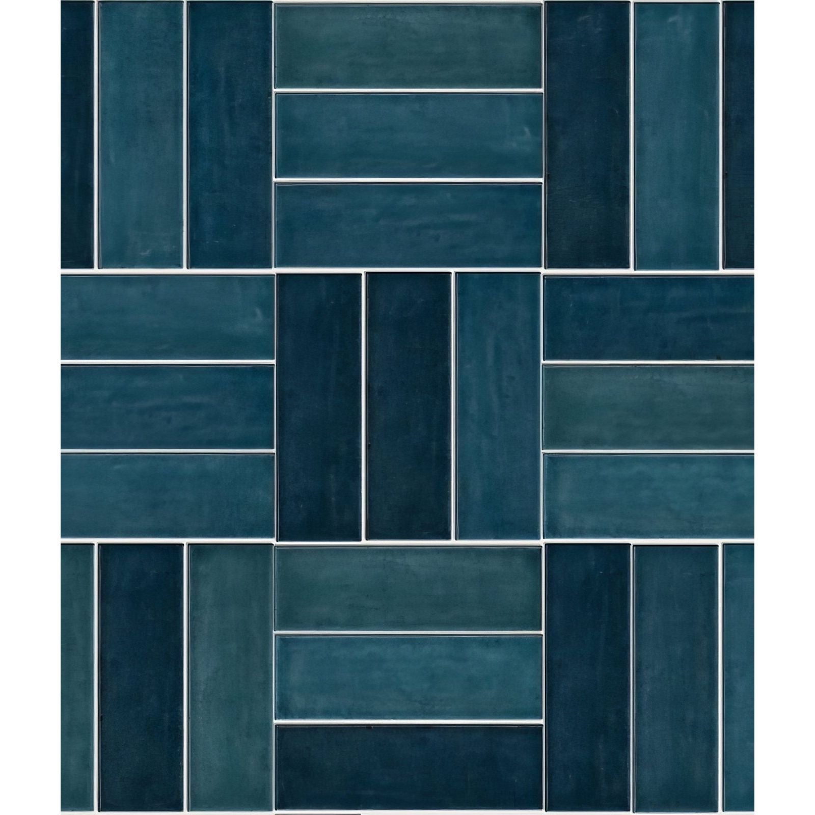Petite porcelain gloss blue rectangular ceramic tiles in teal and navy blue arranged in a herringbone pattern with white grout lines