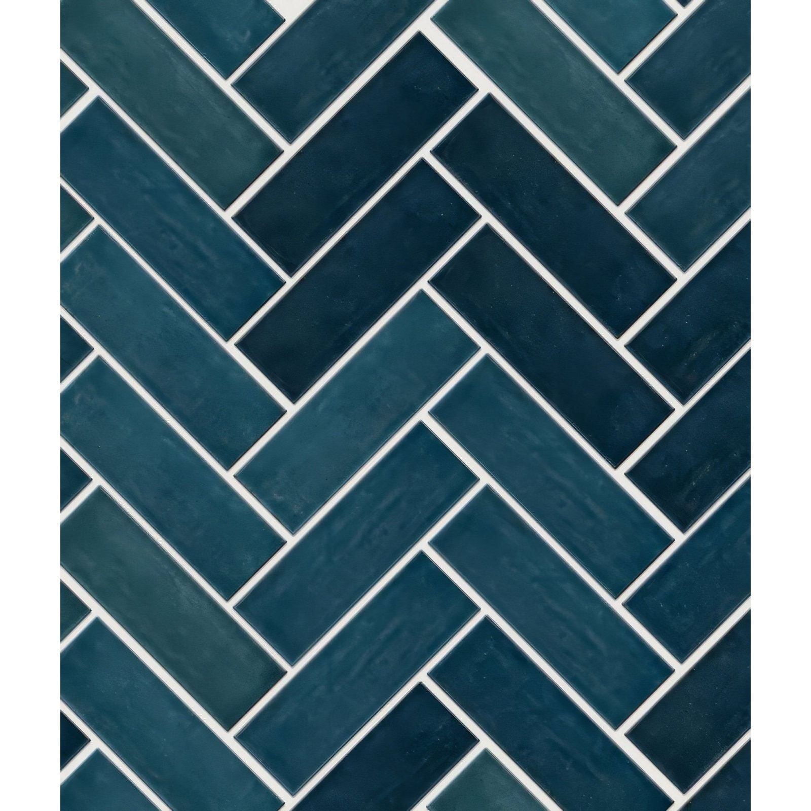 Petite porcelain gloss blue deep teal rectangular tiles arranged in a herringbone pattern with white grout lines