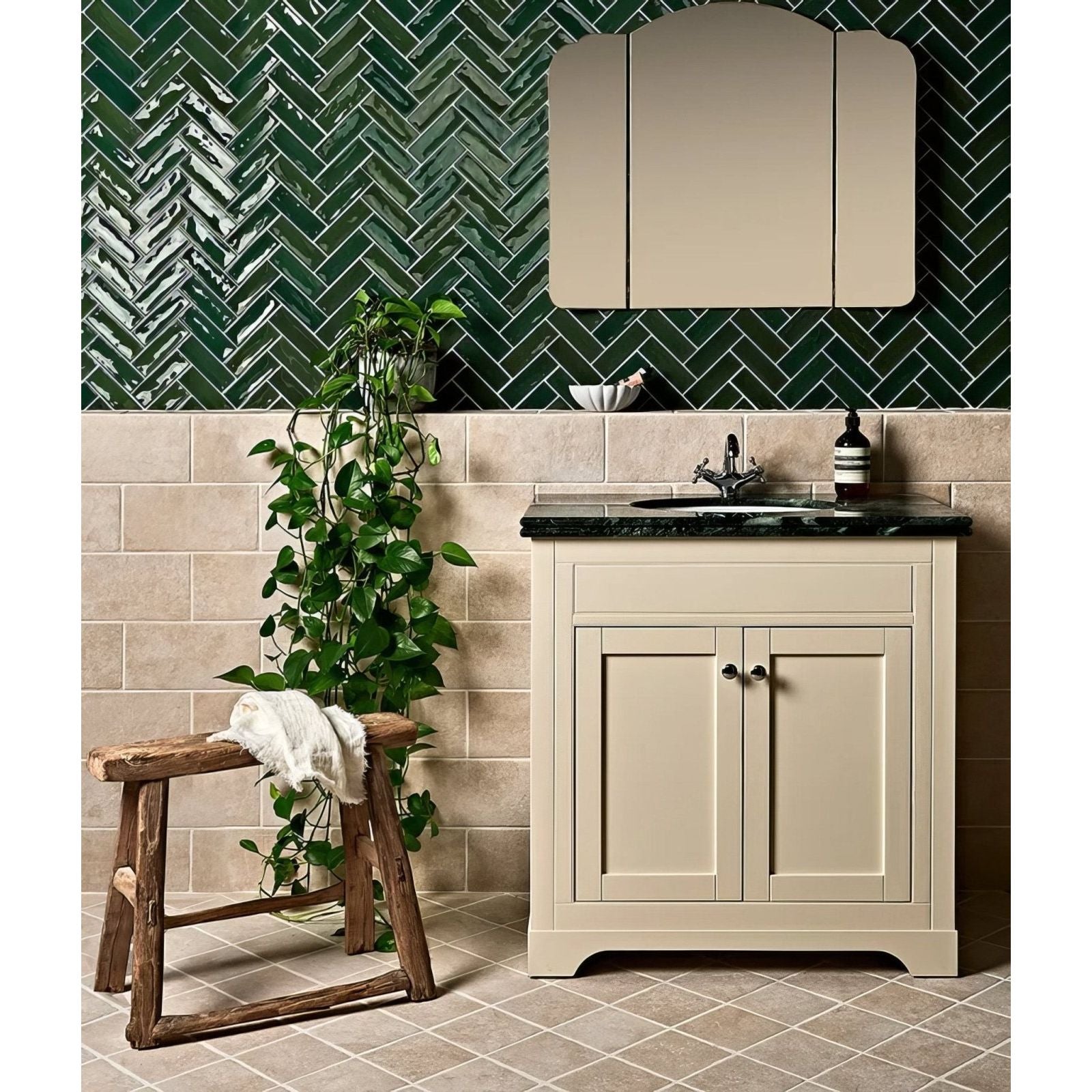 Cream-colored bathroom vanity petite porcelain gloss green with dark marble countertop and integrated sink