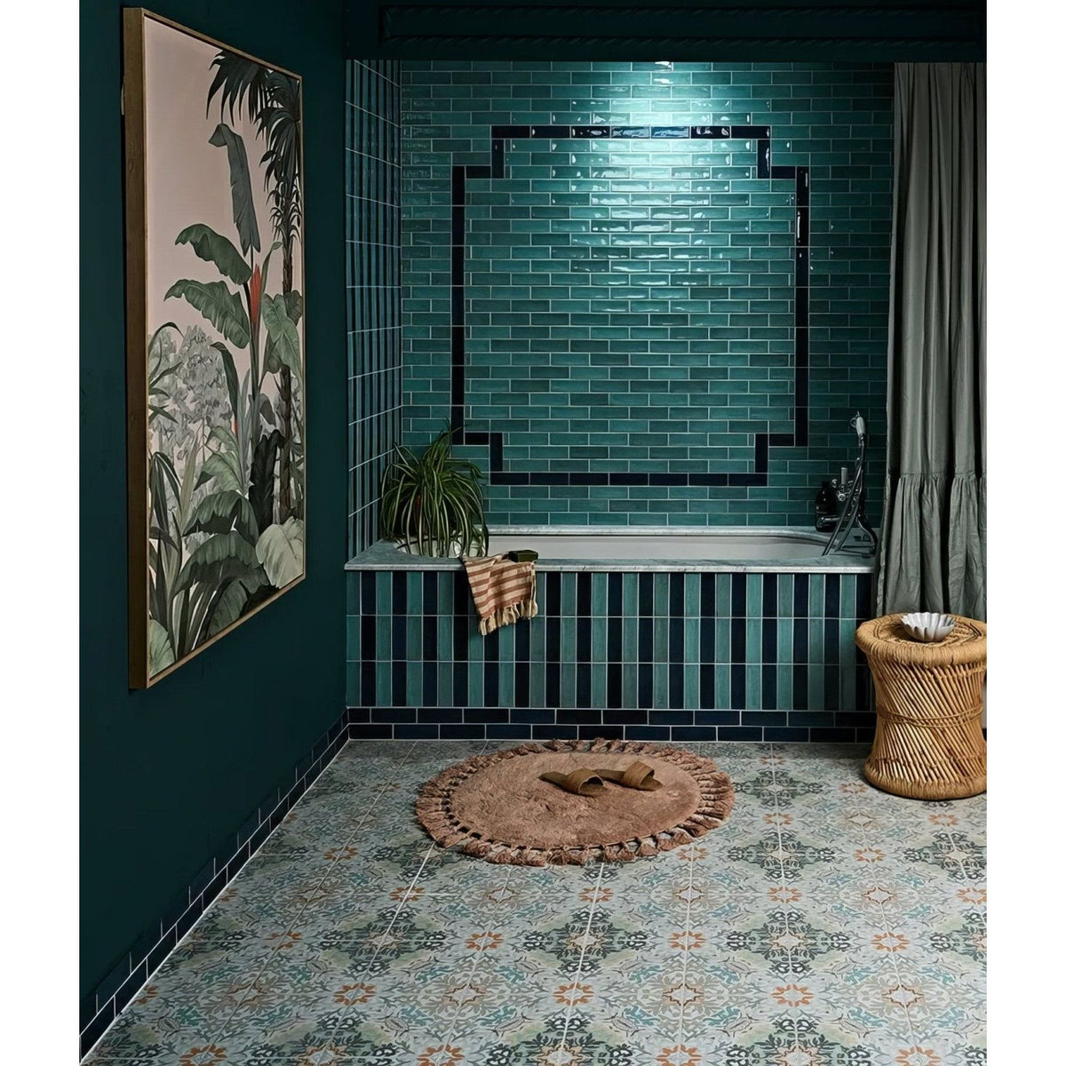 Petite porcelain gloss sky teal-green glossy subway tiles with black grout forming a geometric pattern by bathtub