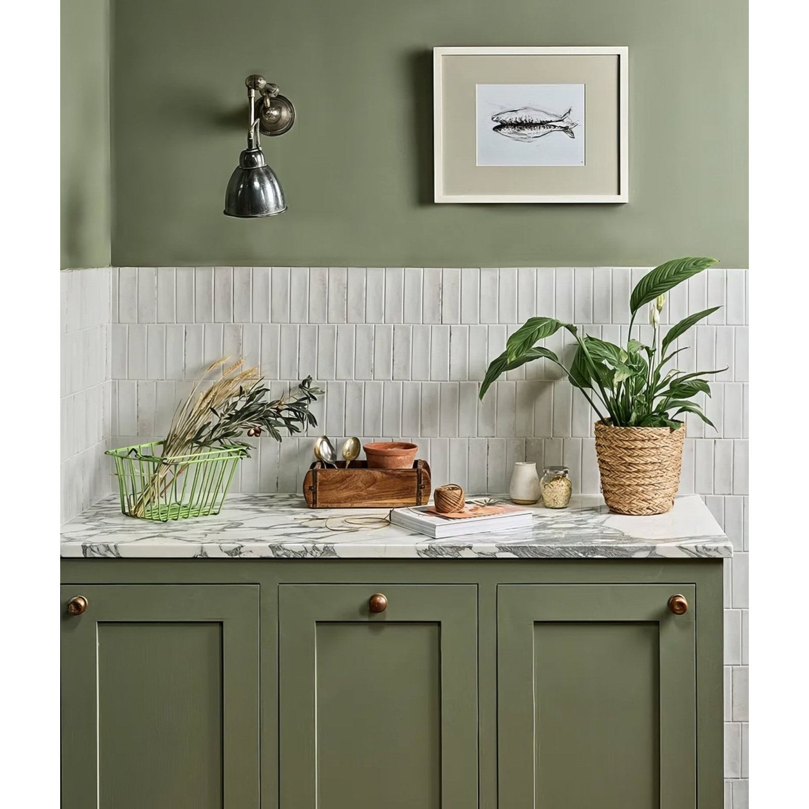 Olive green kitchen cabinets with brass knobs and marble countertop in petite porcelain gloss white design