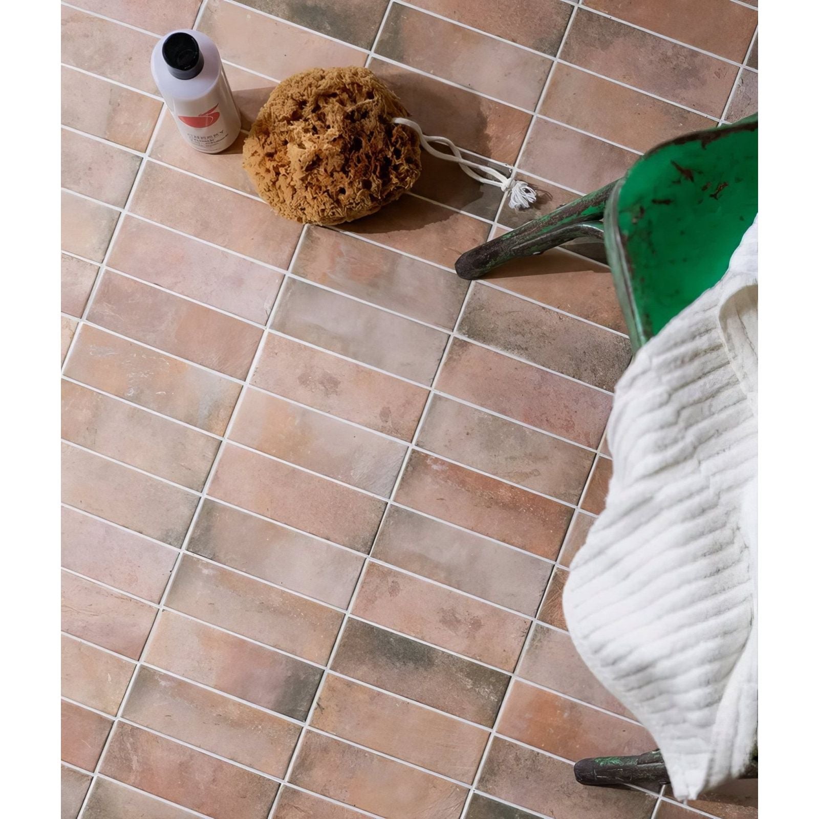Petite porcelain matt cotto dark terracotta rectangular tiles with subtle tone variations arranged in a grid pattern