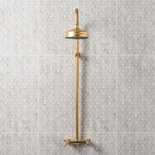 Palazzo Pettina 60x30cm grey and white patterned tiles with a brass showerhead