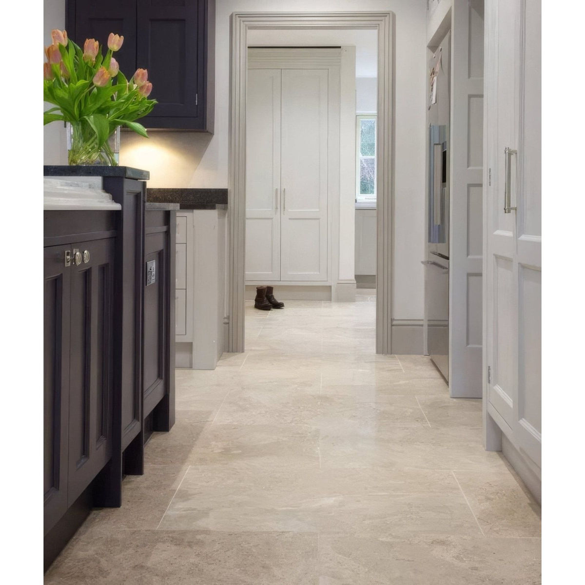 Beige piccadilly limestone floor tiles with subtle veining and polished finish in 60 x 90cm size
