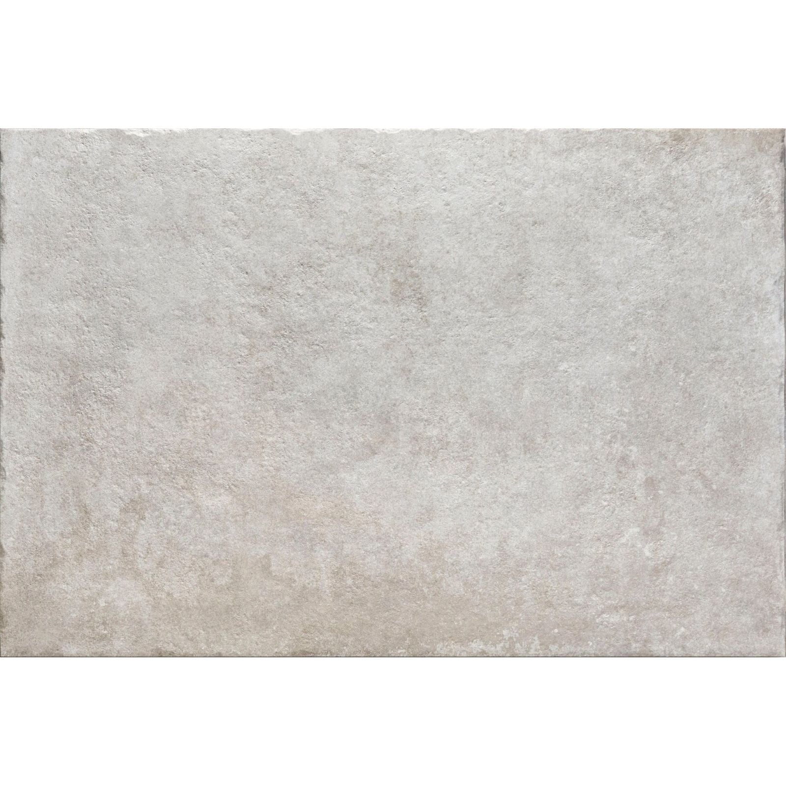 A rectangular textured gray pierre porcelain gris stone tile with a subtle mottled pattern and uneven edges