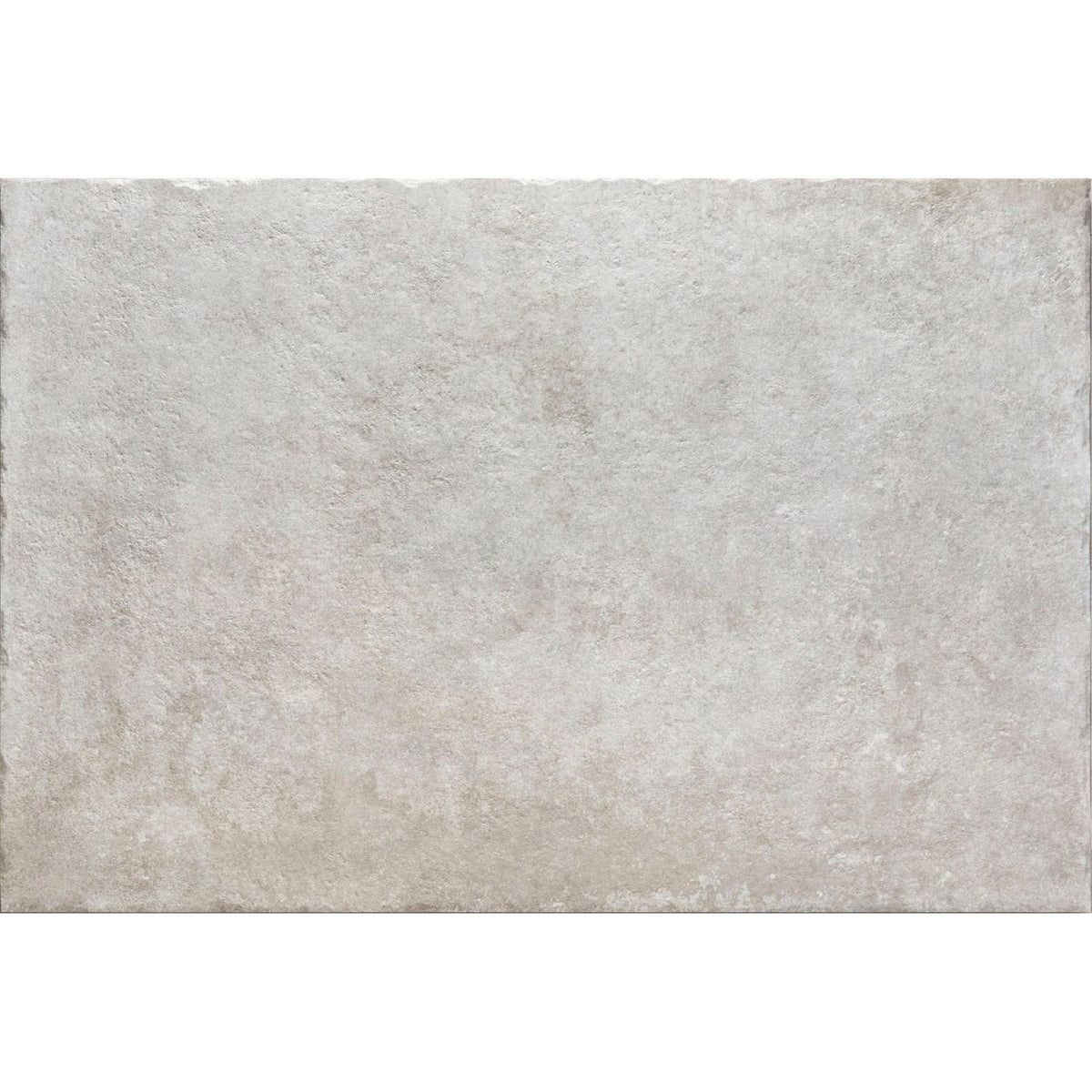 A rectangular textured gray pierre porcelain gris stone tile with a subtle mottled pattern and uneven edges