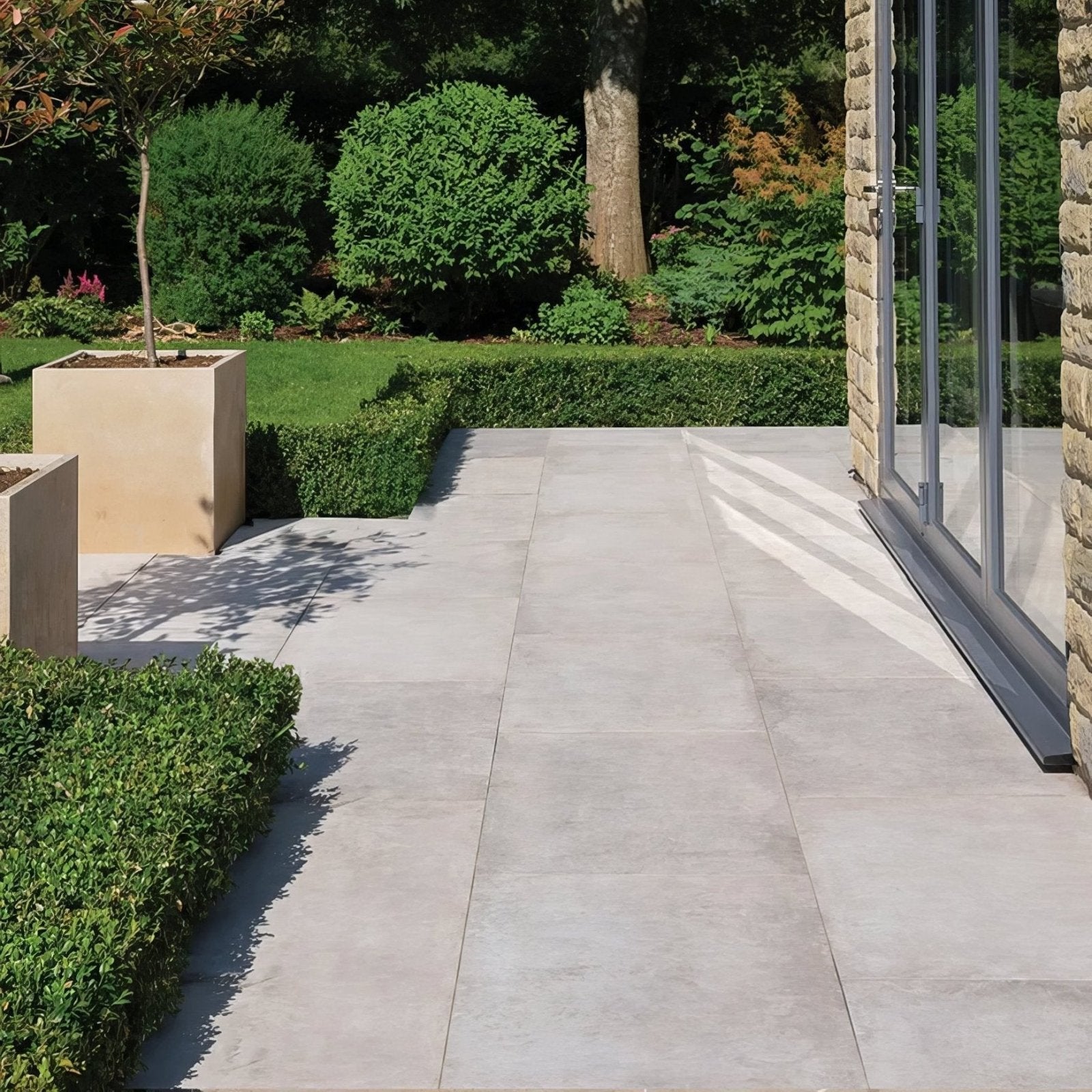 Light gray pierre porcelain paving gris patio tiles with smooth slightly textured stone surface