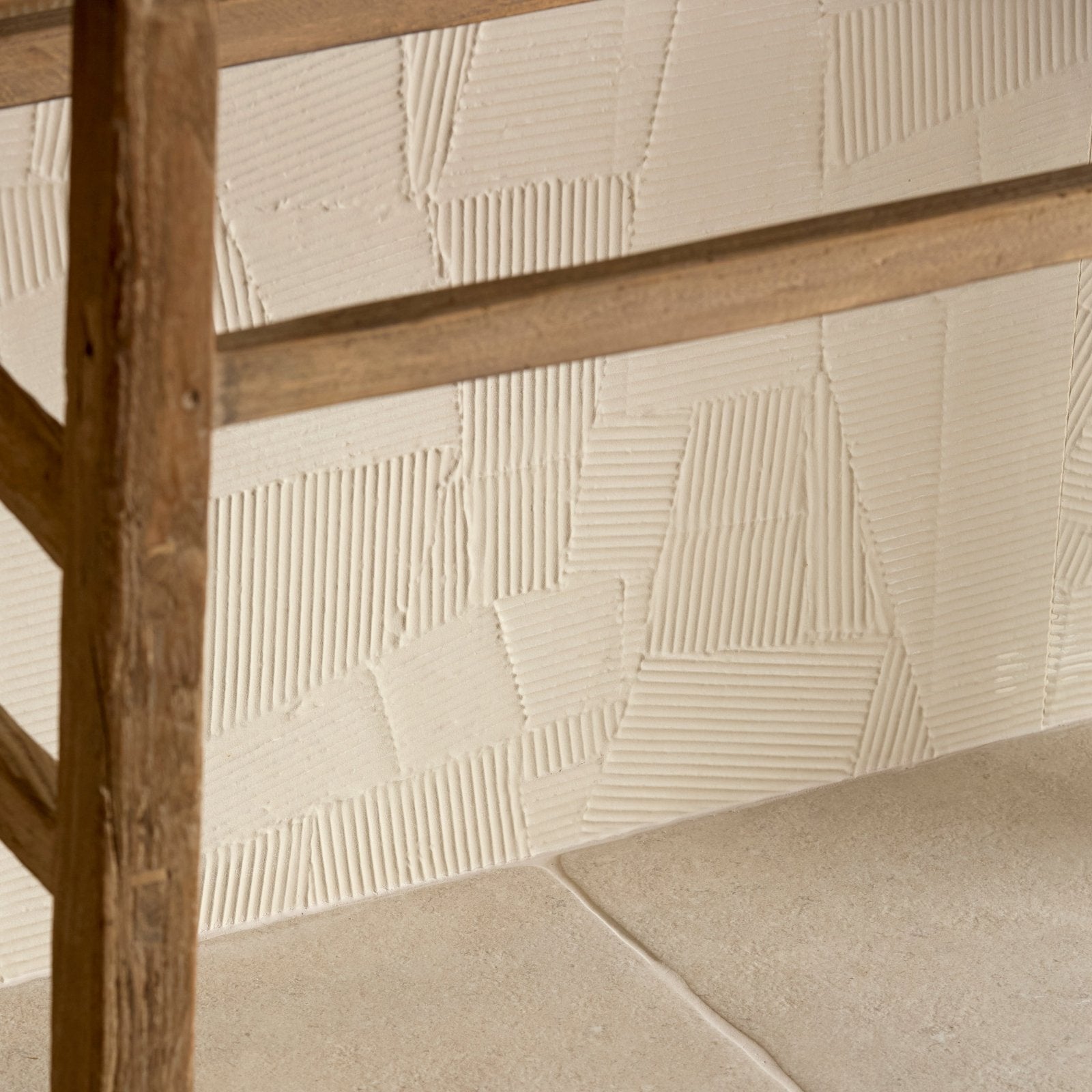 Beige textured porcelain wall tiles with geometric ridged patterns from plastercraft calco sabbia collection