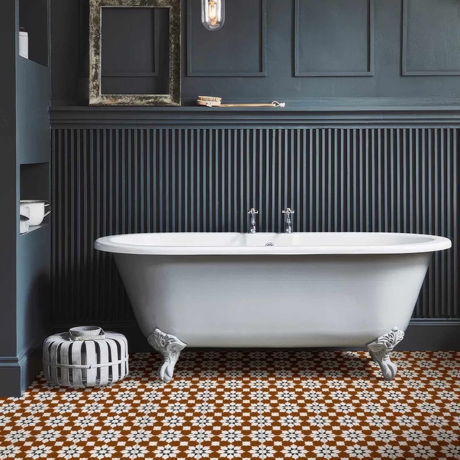 White clawfoot bathtub with chrome fixtures in porcelain finish from belleville vendome red collection