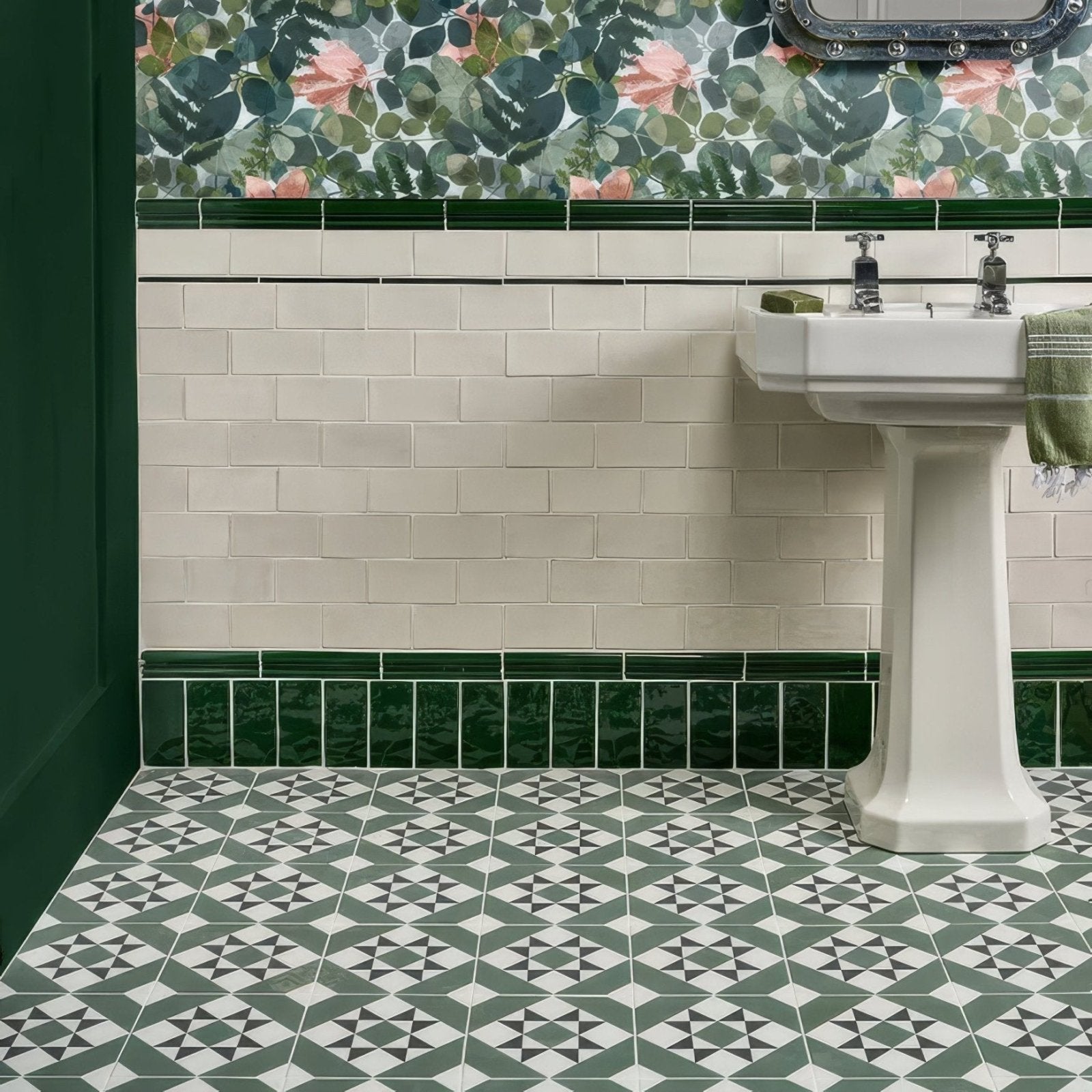 White porcelain brompton greenwich pedestal sink with chrome faucets and green towel draped over side