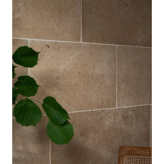 Beige buscot blend limestone stone tiles with textured natural tumbled finish for flooring and wall use