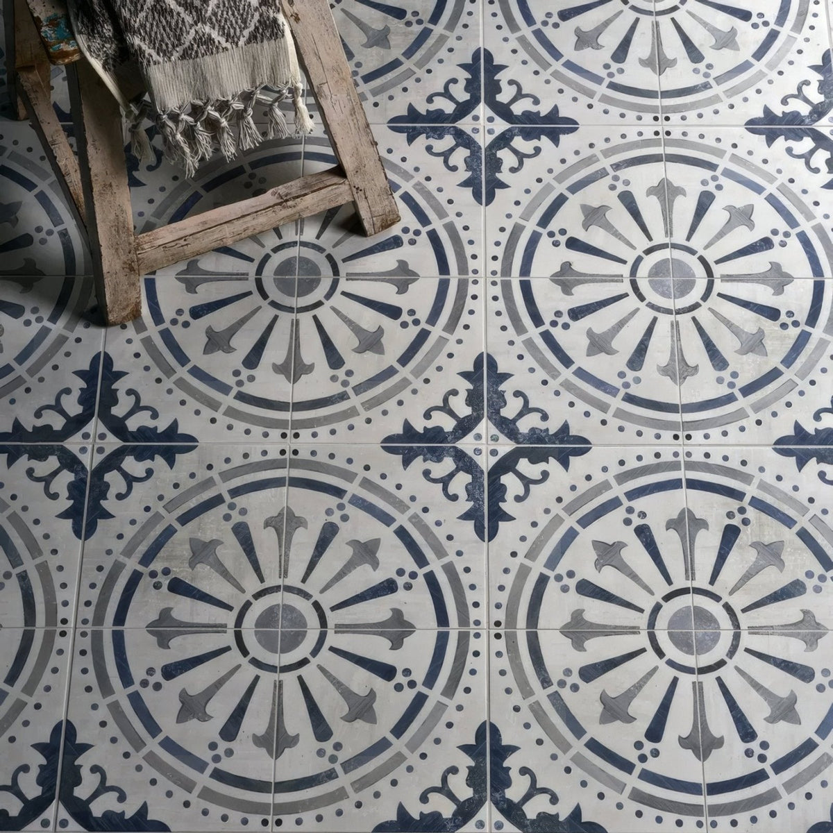 Canero ceramic matt floor tiles in blue and gray with ornate circular patterned ceramic design