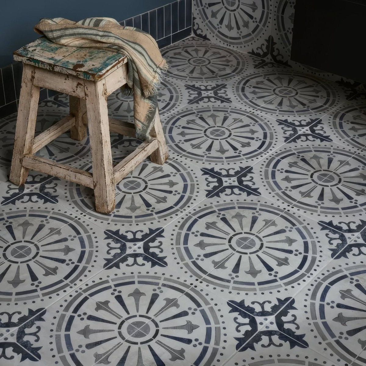 Canero ceramic matt patterned floor tiles with intricate circular and geometric designs in gray black and white shades