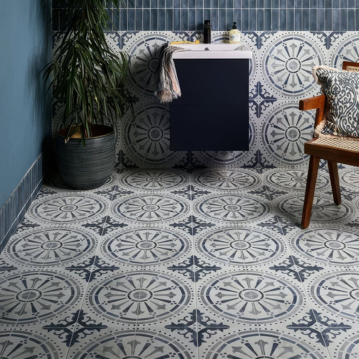 The canero ceramic matt bathroom floor features intricate vintage-inspired geometric patterned ceramic tiles