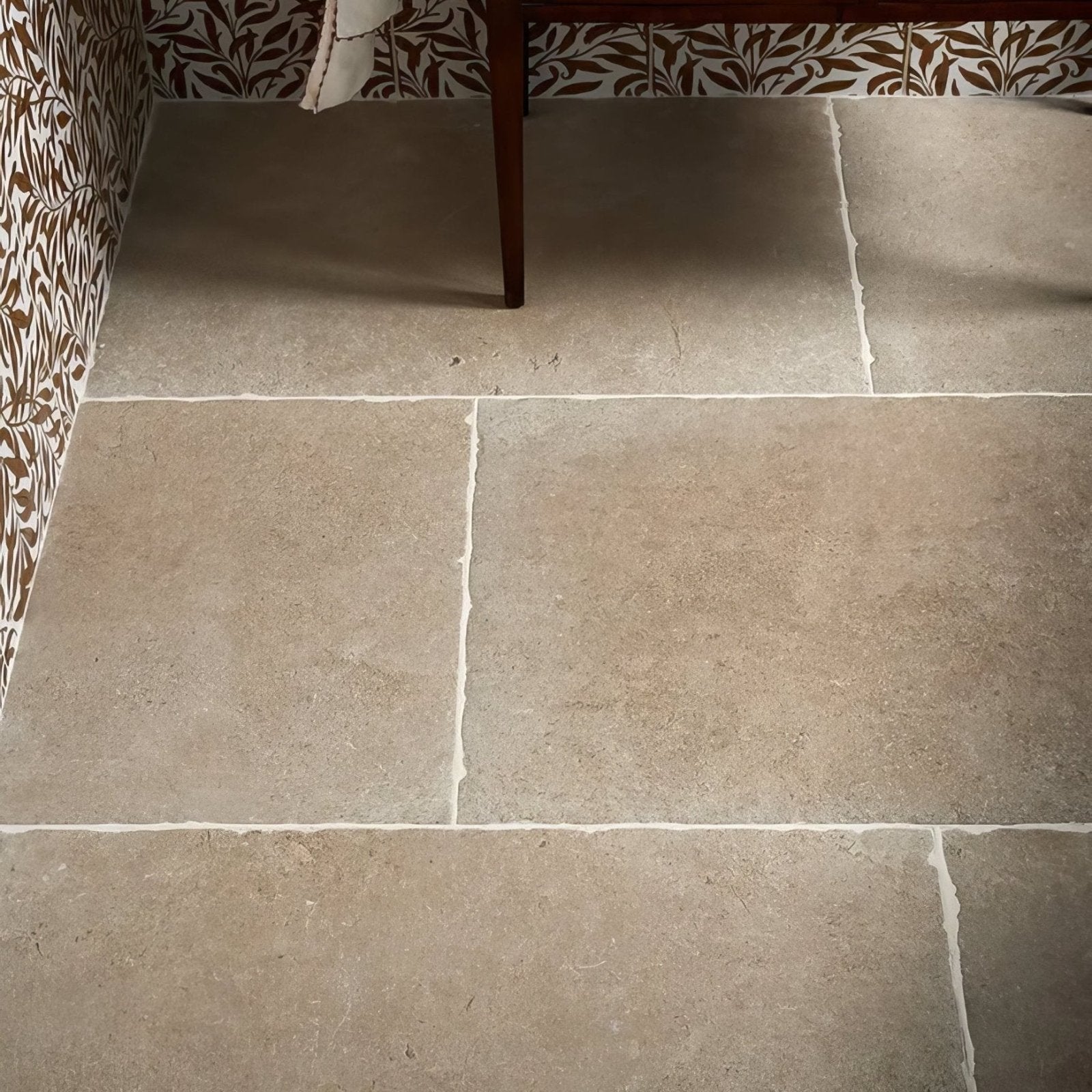 Beige cotswold porcelain matt stone tiles with natural textured surface and visible grout lines