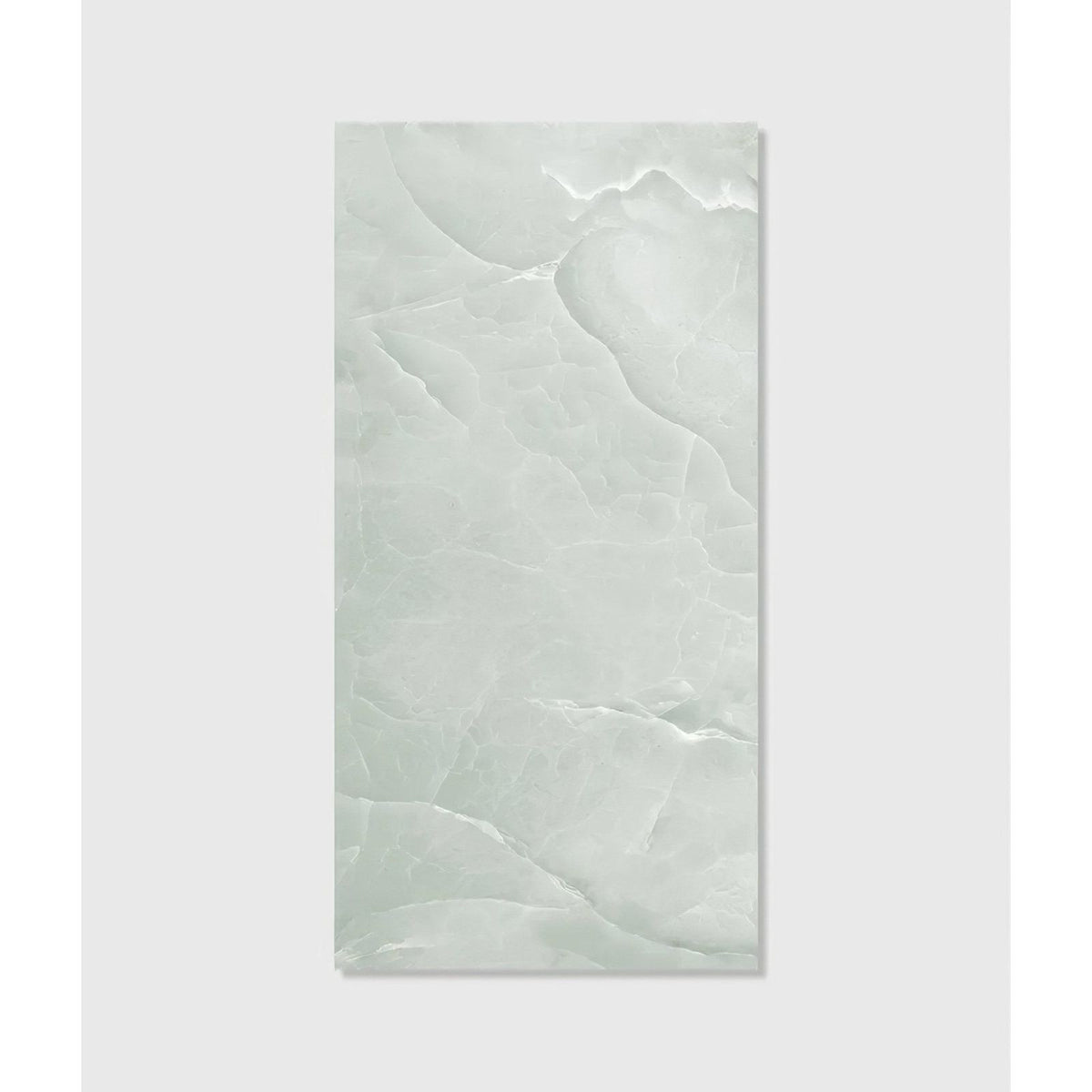 Illuson whisper onyx porcelain polished lagoon tile is pale green ceramic with smooth glossy finish and subtle veining