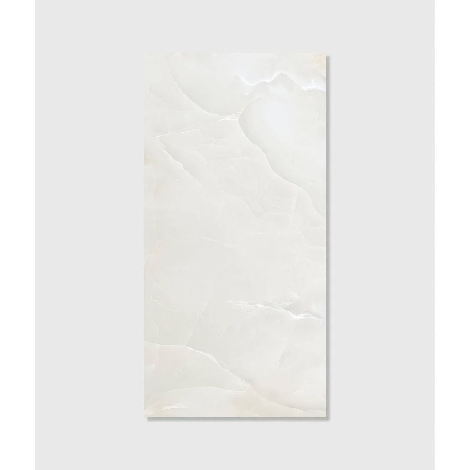 A sleek rectangular white marble illusion Whisper Onyx porcelain polished mist tile with subtle veining and glossy finish