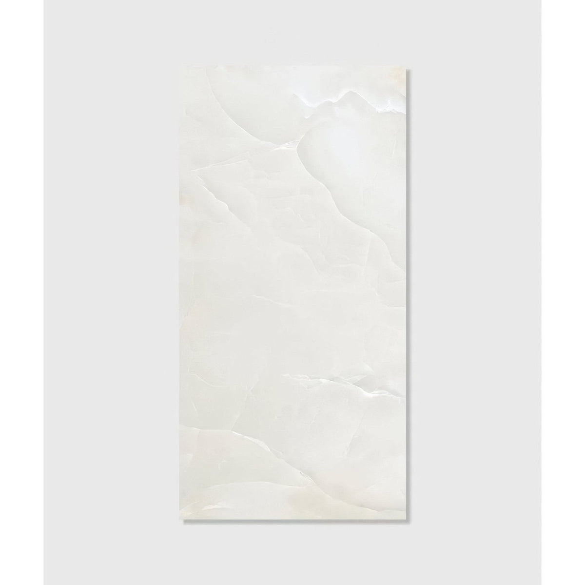 A sleek rectangular white marble illusion Whisper Onyx porcelain polished mist tile with subtle veining and glossy finish