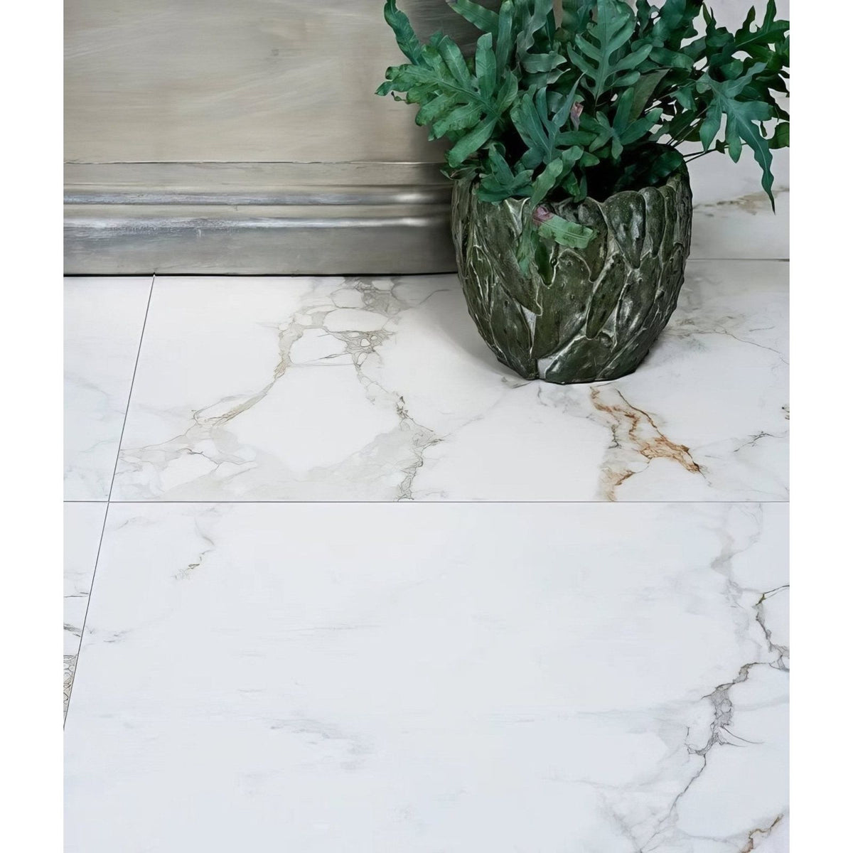 Muscat Porcelain 59.5 x 59.5cm white marble-effect tiles with a planter and fern