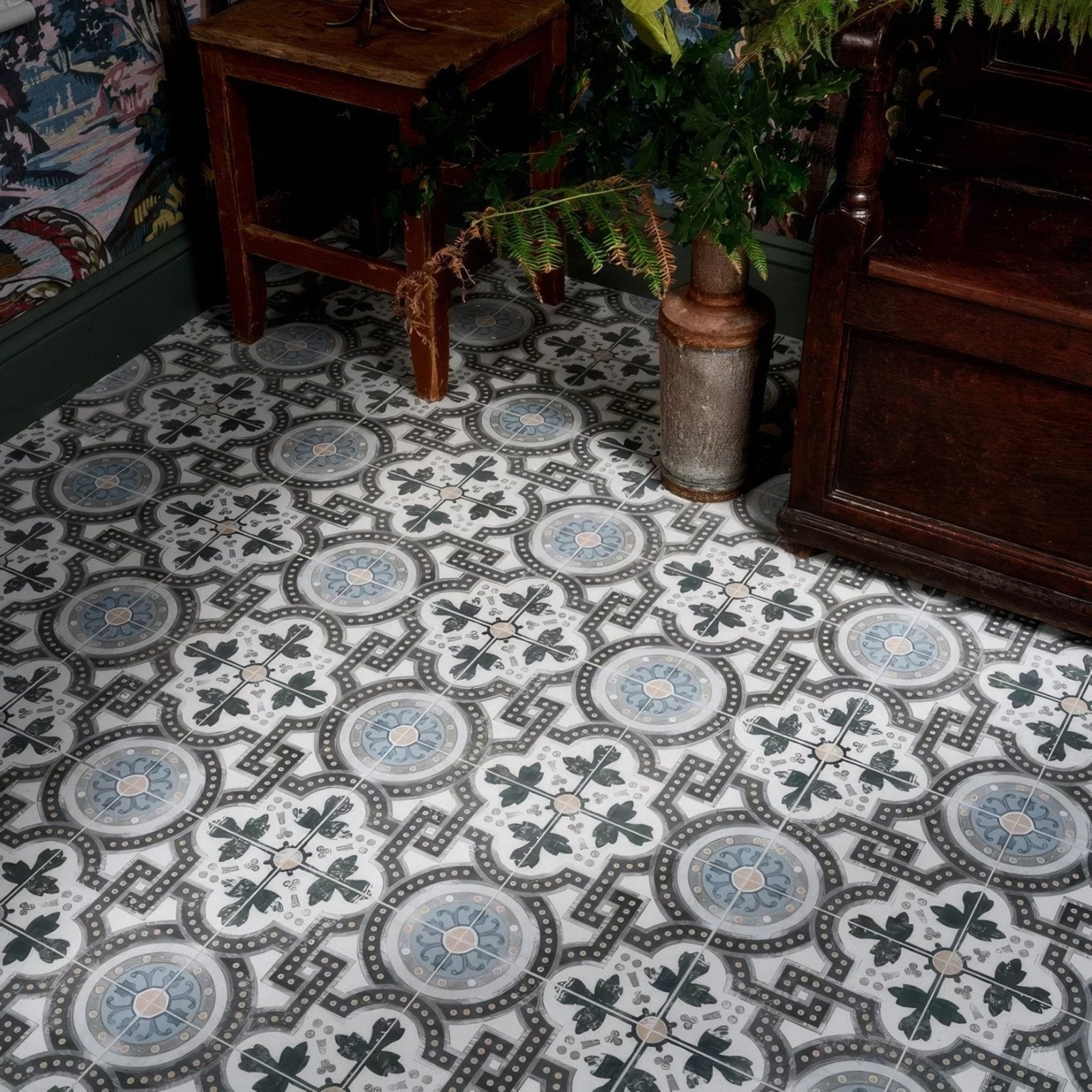 Orleans ceramic matt vinyl floor tiles with vintage circular motifs in shades of gray and blue on white background