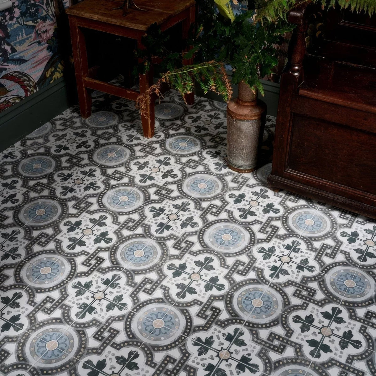 Orleans ceramic matt vinyl floor tiles with vintage circular motifs in shades of gray and blue on white background