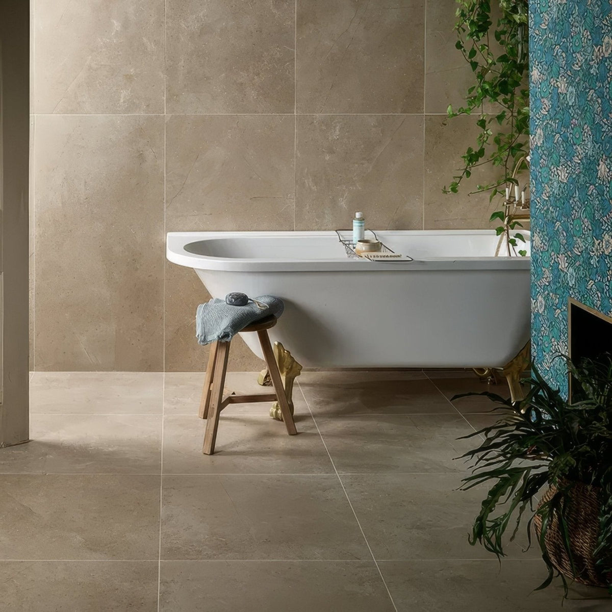 Winchester Porcelain Satin 60 x 60cm beige stone-effect porcelain tiles with a freestanding bathtub
