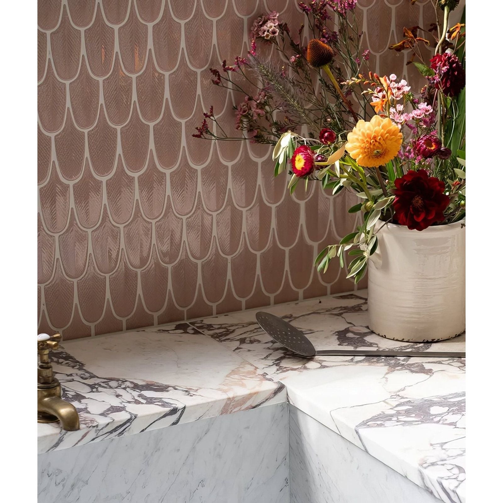 Preen Porcelain Mosaic Blush rose gold scalloped porcelain mosaic with a white vase of flowers