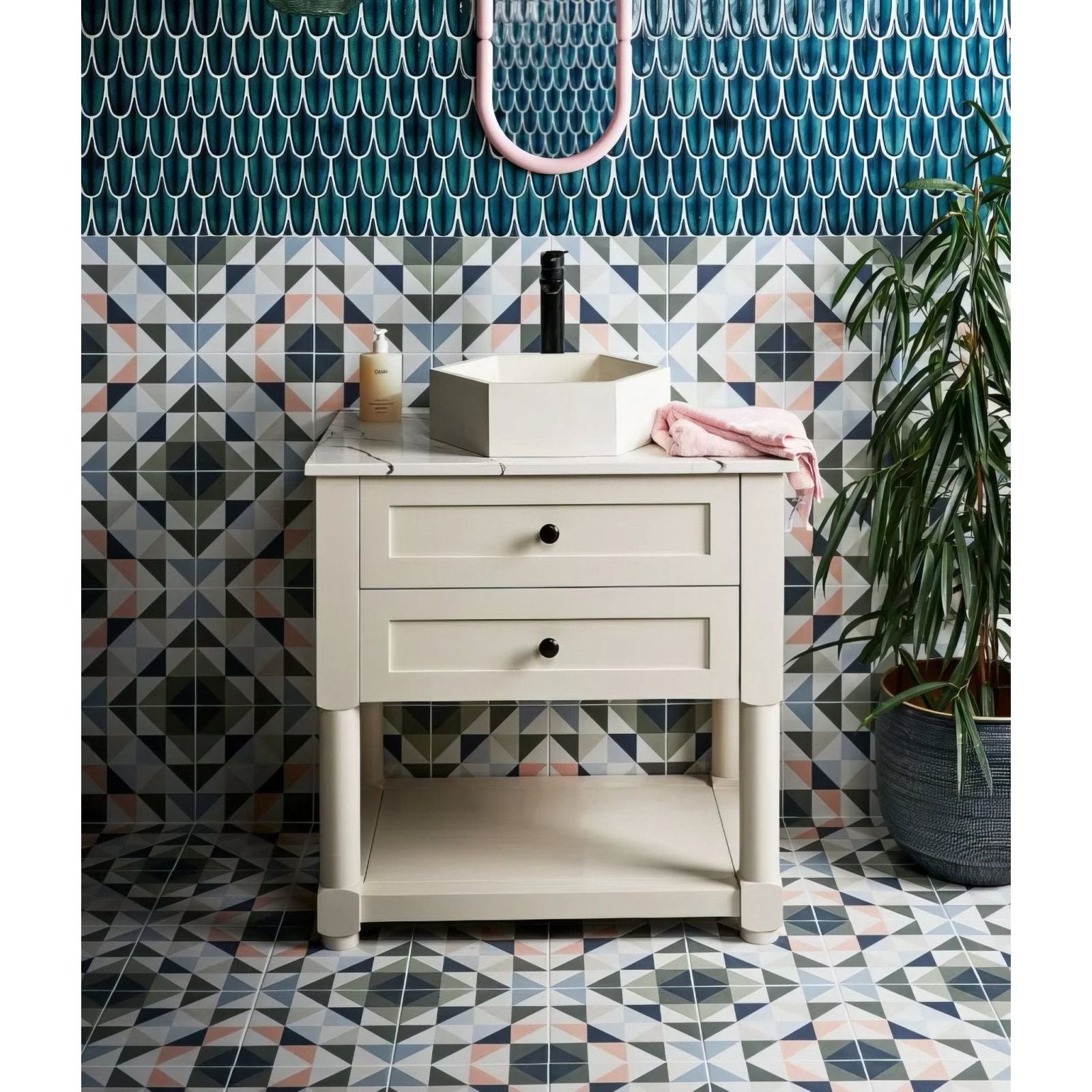 Preen Porcelain Mosaic Verdigris teal porcelain fish-scale mosaic with a cream vanity and hexagonal sink