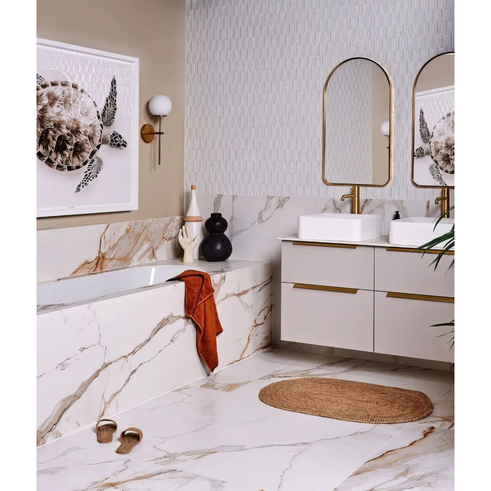 Preen Porcelain Mosaic White white porcelain fish-scale mosaic with a marble bathtub and gold fixtures