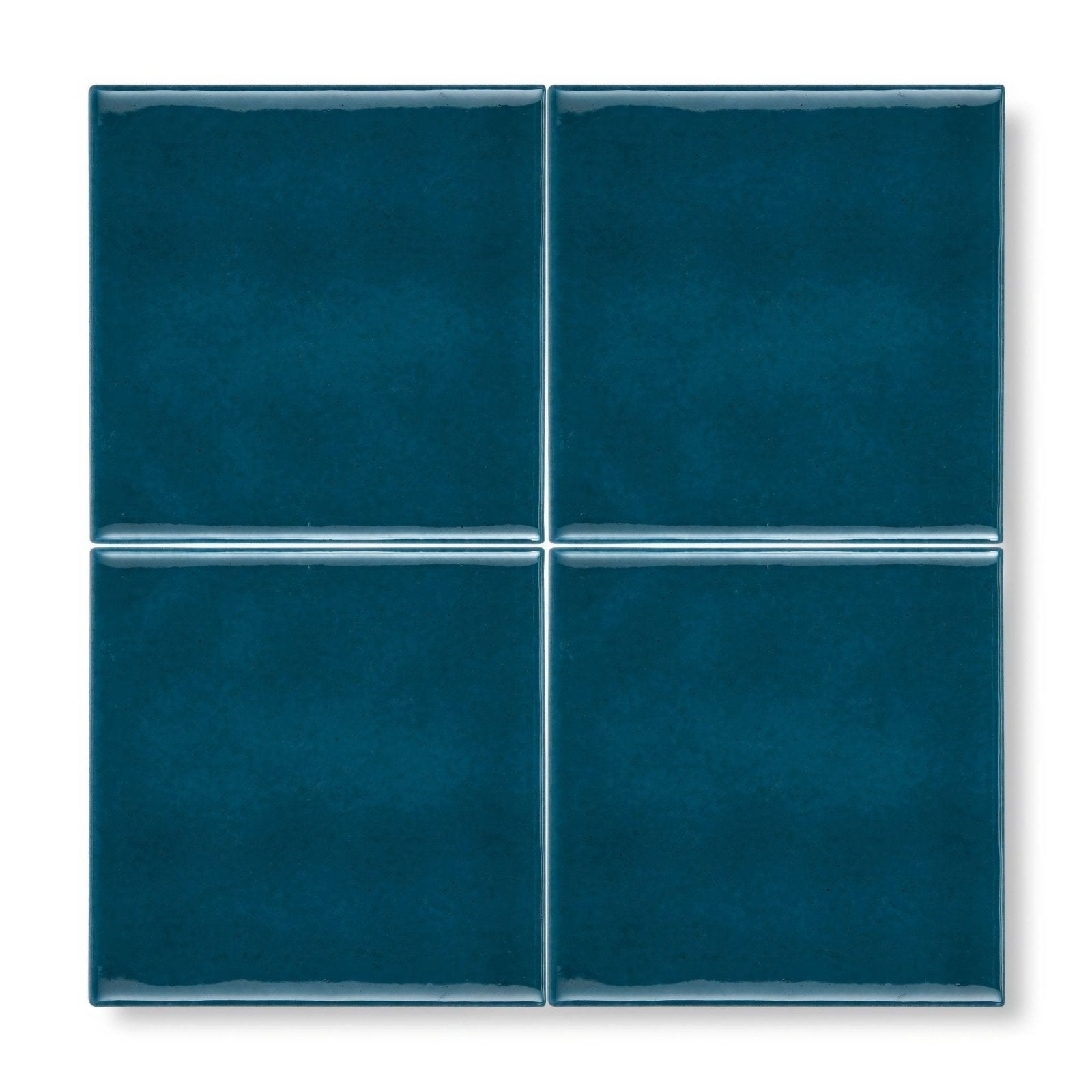 Deep teal glossy ceramic tiles arranged in a 2x2 grid from the provence monaco square collection