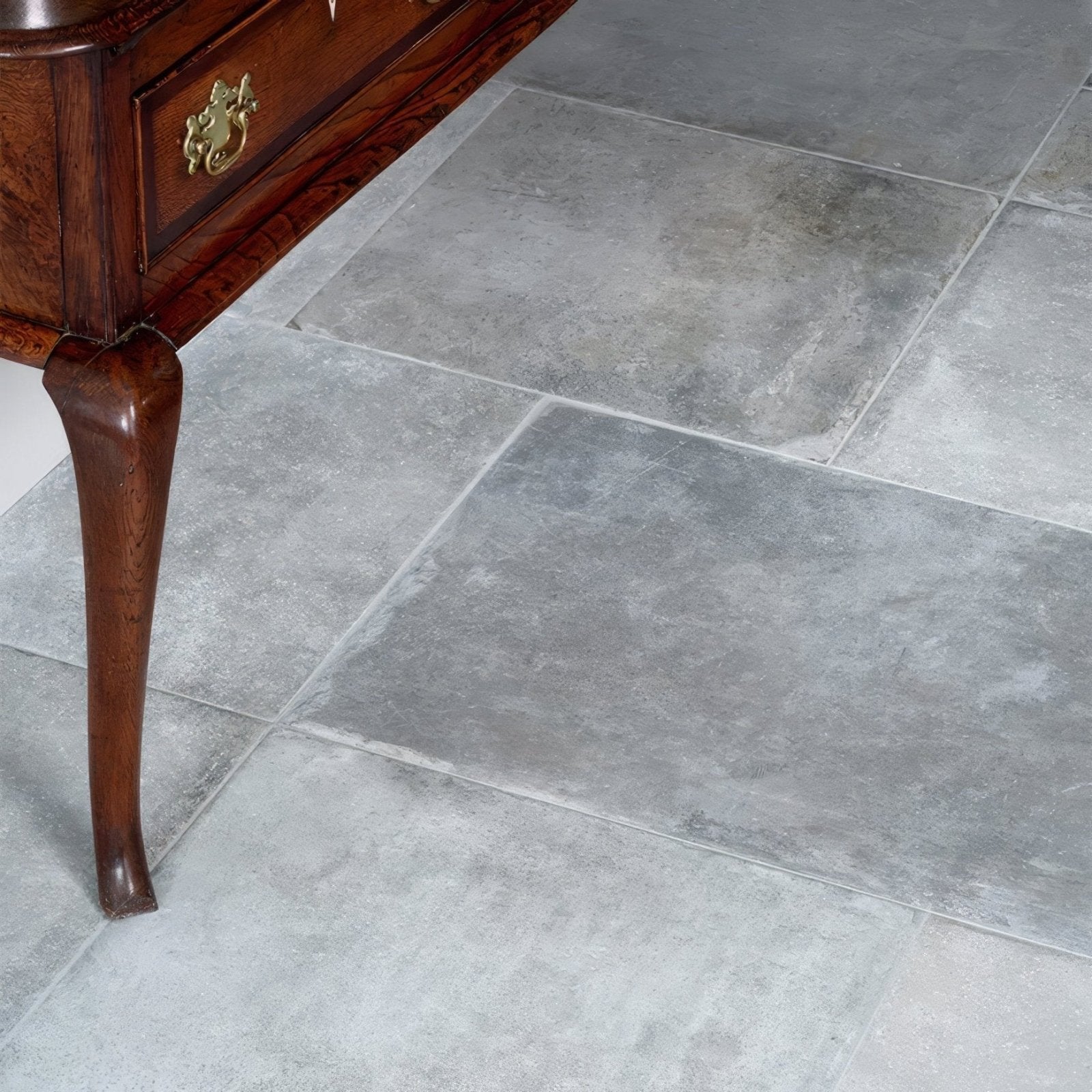 Gray porcelain tiles with subtle natural texture and slight tone variations from the provence porcelain cenere collection