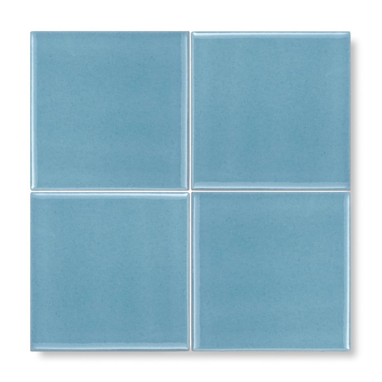 Set of four light blue matte ceramic Provence Turbie square tiles arranged in a grid for wall or floor use