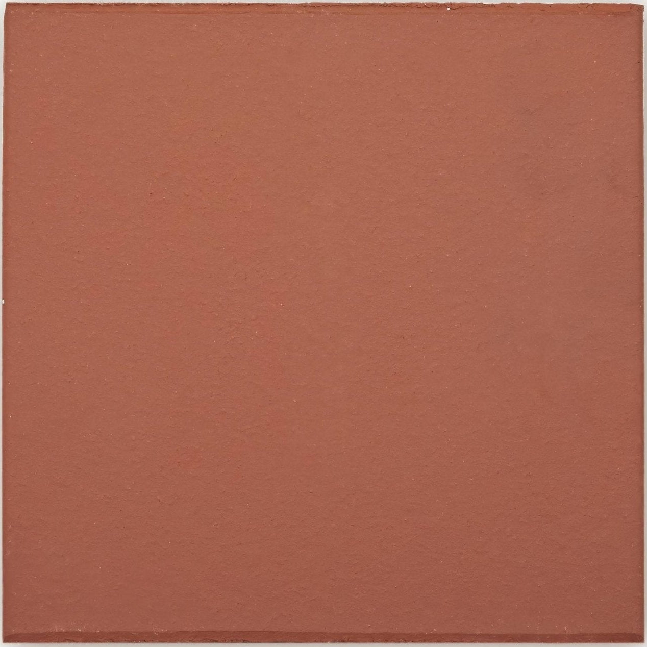 A square terracotta quarry red ceramic tile with a matte finish and subtle surface texture