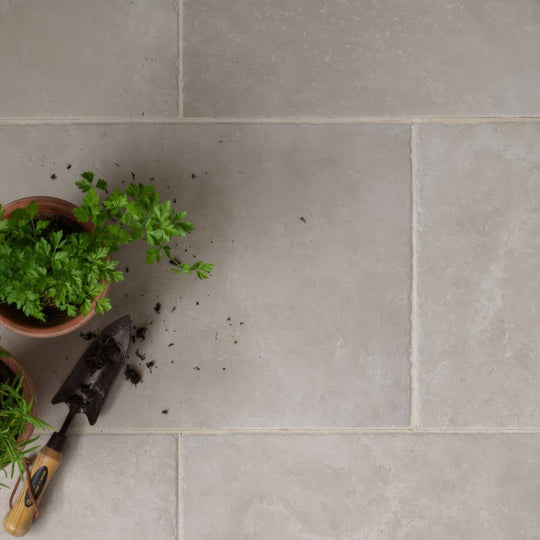 A terracotta pot holding lush green parsley featured in quintili beige 40 x 60cm product image