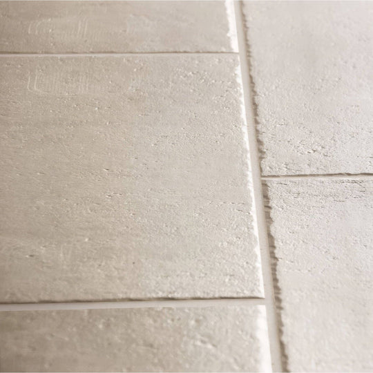 Quintili beige 60 x 90cm light gray textured rectangular tiles with subtle embossed patterns and visible grout lines