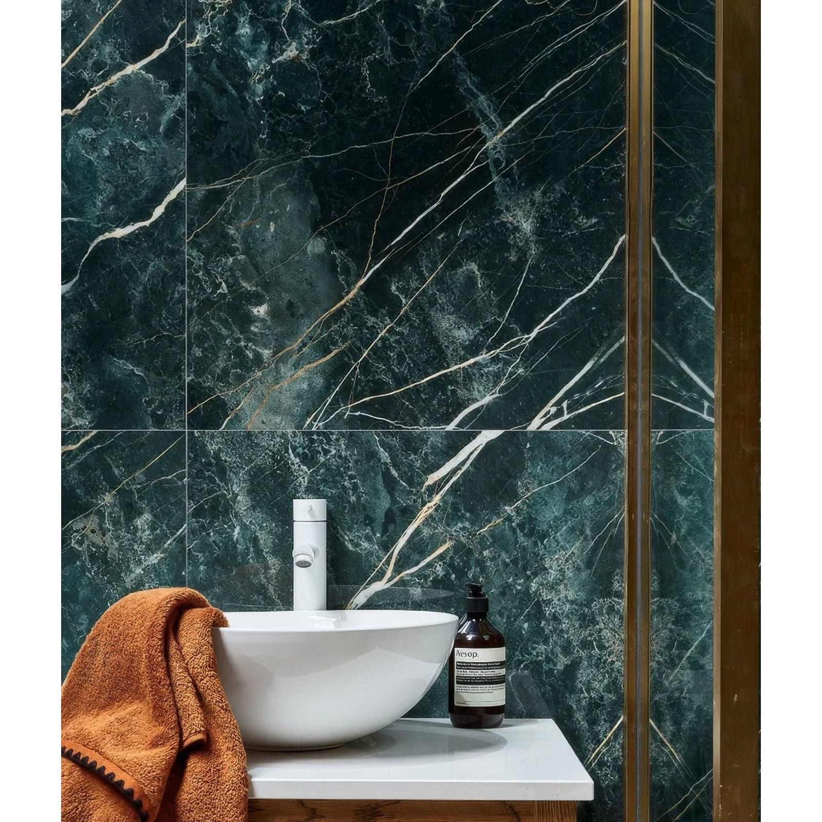 Rainforest Porcelain Malachite dark green marble-effect tiles with a white bowl sink