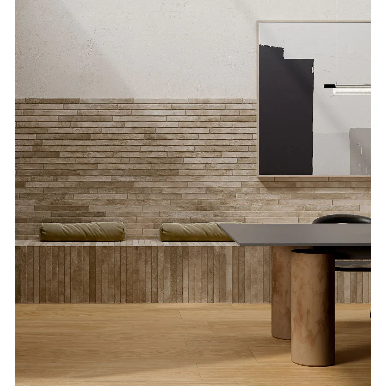 Modern minimalist dining table with a matte black top and cylindrical concrete legs featured with ramsbury sand terracotta effect tiles