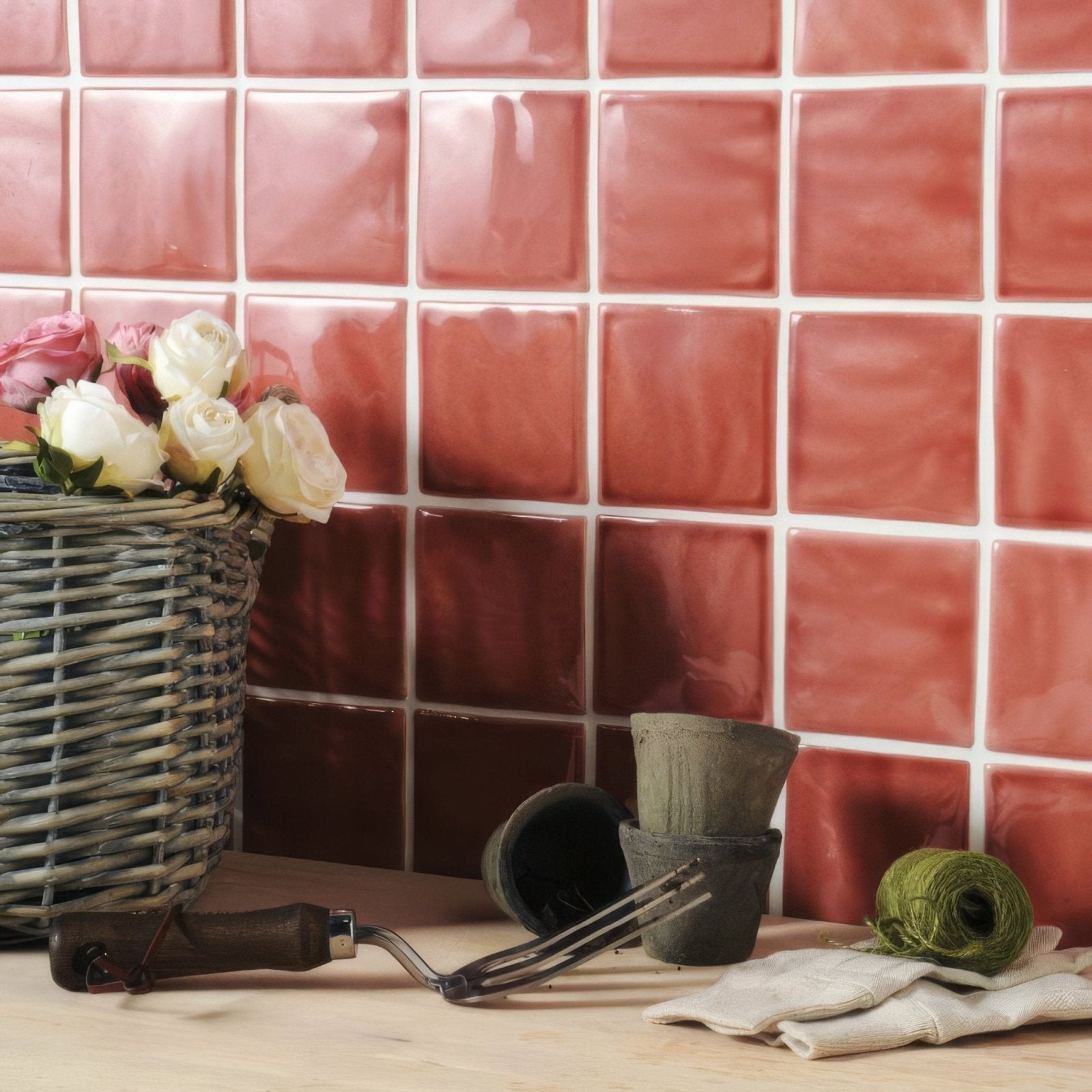 Woven gray basket filled with pink and white roses featuring raspberry field tile pattern design
