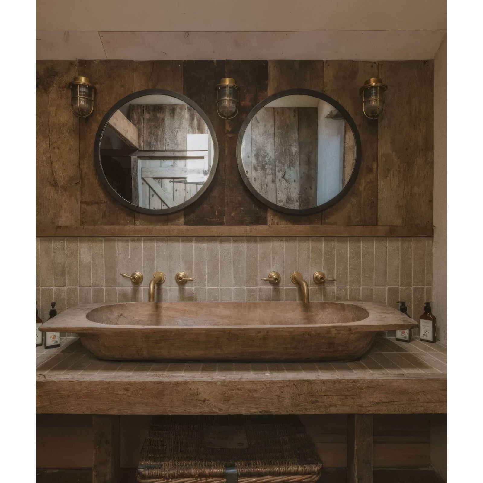 Rustic wooden vessel sink with smooth natural finish and integrated brass fixtures in reform composite stone tumbled khaki
