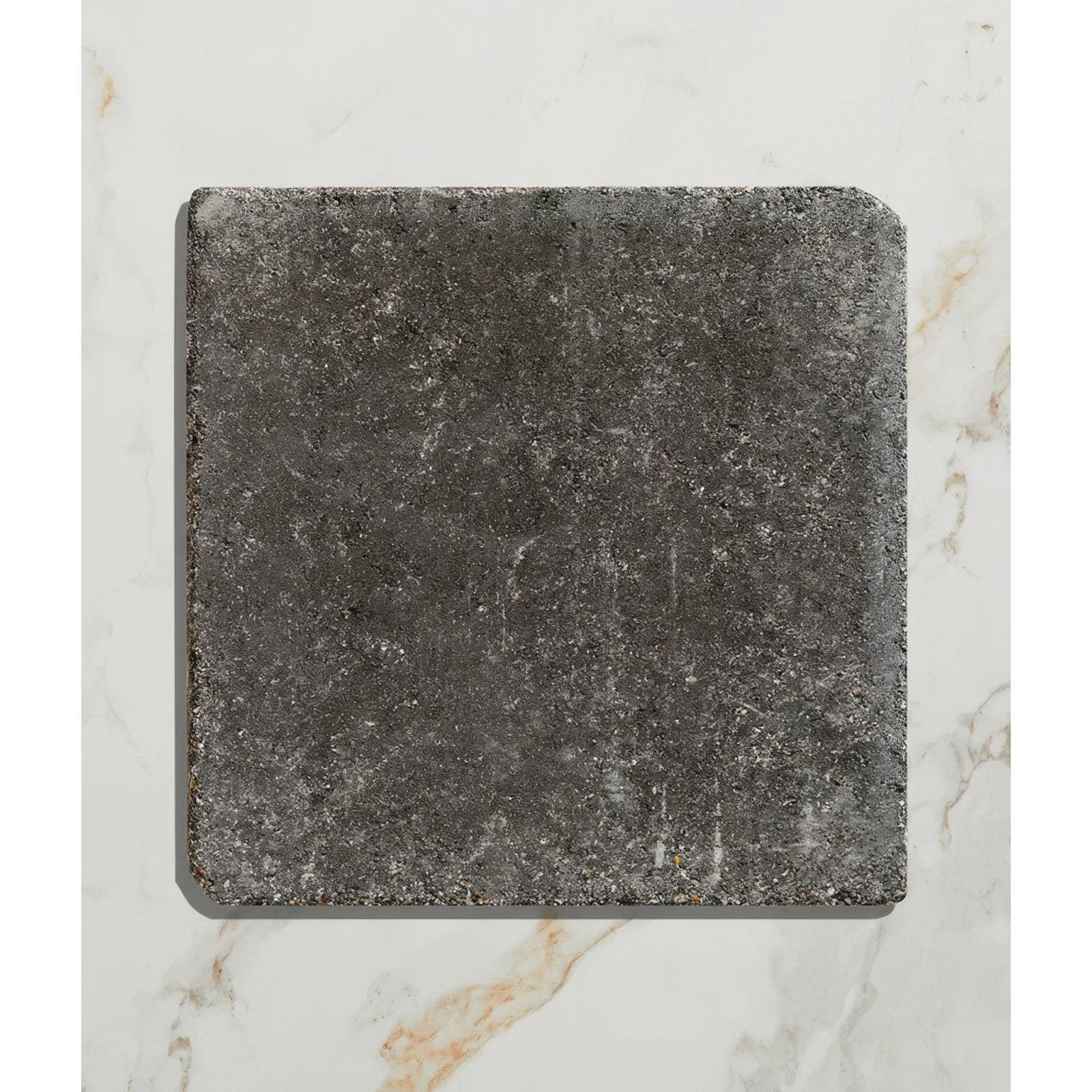Dark gray textured reform composite stone tumbled nero tile with a rustic weathered finish for flooring and walls