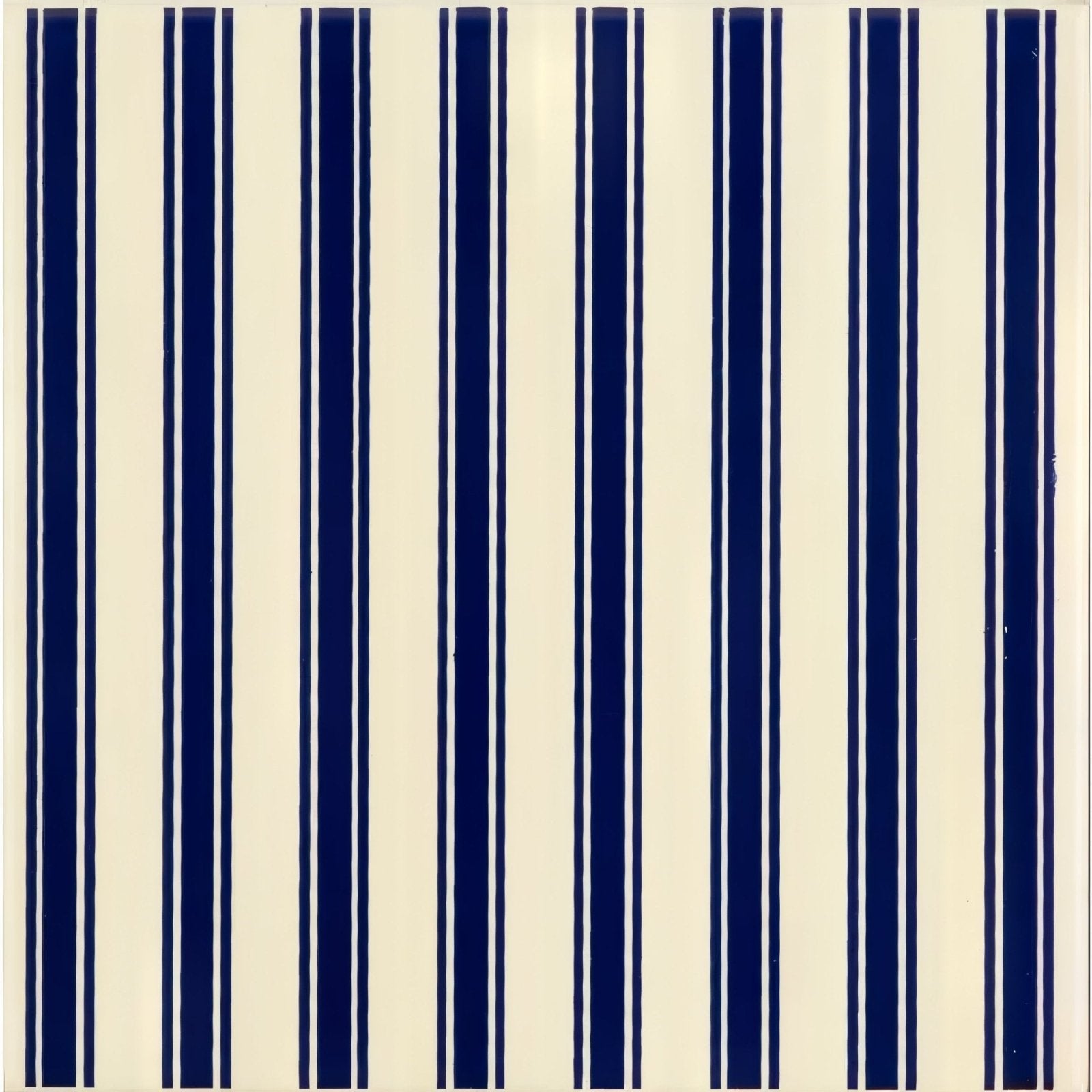 Cream-colored tile with bold navy blue vertical stripes and thin white lines from regency stripe royal blue on county white collection