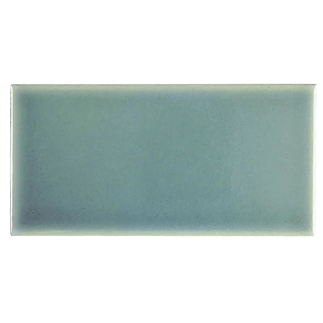 A rectangular soft sage green glazed ceramic tile with a matte finish retro metro green park 7.5 x 15