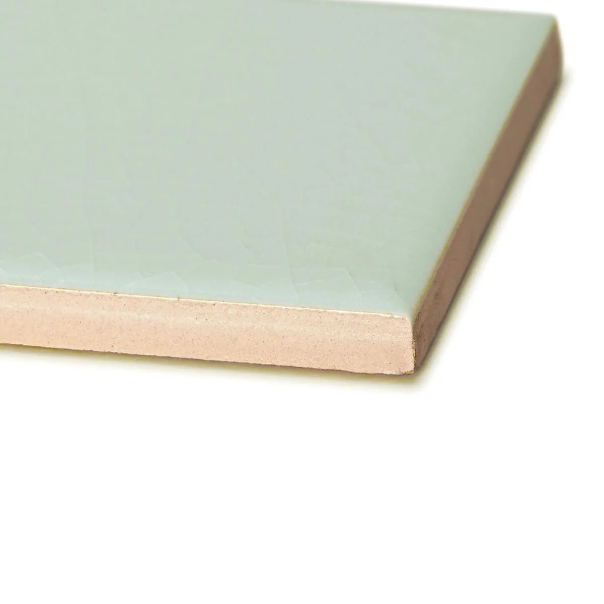 A square ceramic retro metro lido blue glazed tile with smooth matte mint green glaze and unglazed beige clay edge