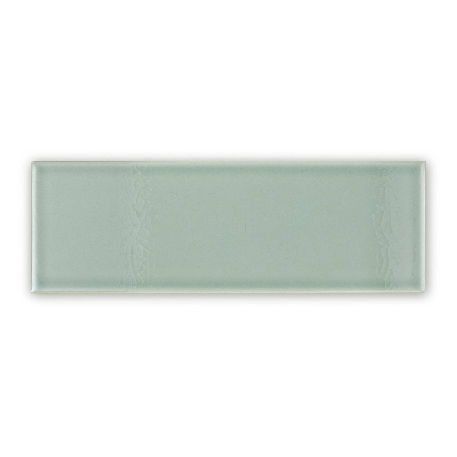 A sleek rectangular glazed glass tile in soft sage green with textured ridges retro metro lime house 10 x 30