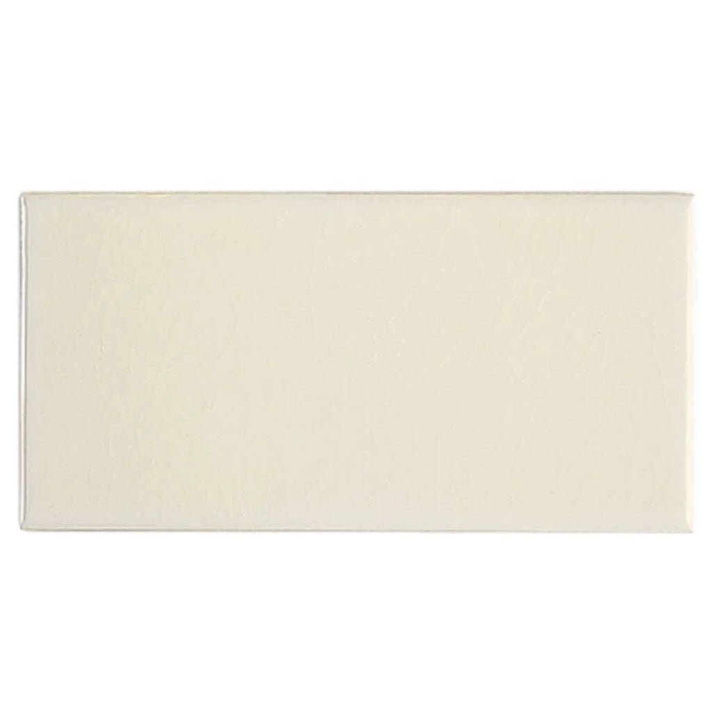 Cream-colored rectangular ceramic tile with smooth glossy finish retro metro marble arch 7.5 x 15 glazed tile